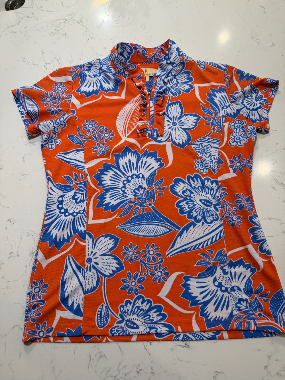 Sport Haley Orange Polo Top with Blue Floral Print